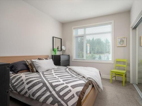 201-6544 Metral Dr, Nanaimo, BC - Indoor Photo Showing Bedroom