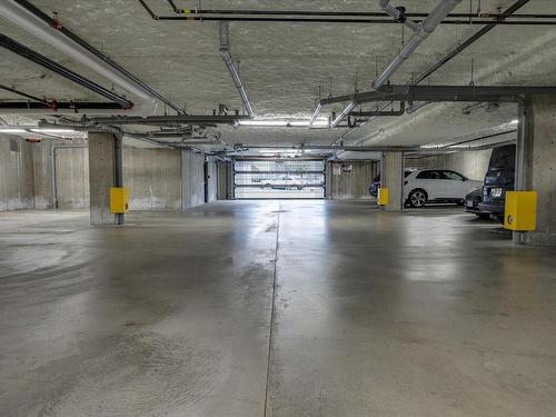 201-6544 Metral Dr, Nanaimo, BC - Indoor Photo Showing Garage