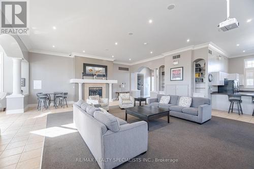 211 - 1480 Bishops Gate, Oakville, ON - Indoor Photo Showing Living Room With Fireplace