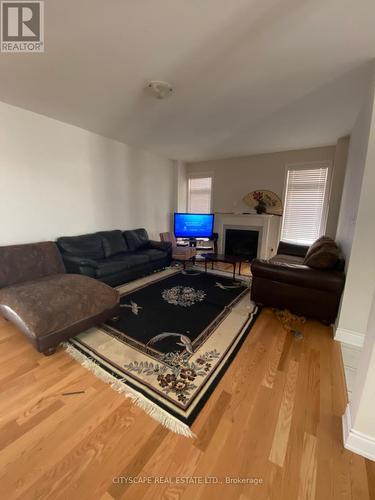 Upper - 59 Elysian Fields Circle, Brampton, ON - Indoor Photo Showing Living Room With Fireplace