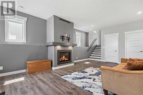 1 Toal Close, Red Deer, AB - Indoor Photo Showing Living Room With Fireplace