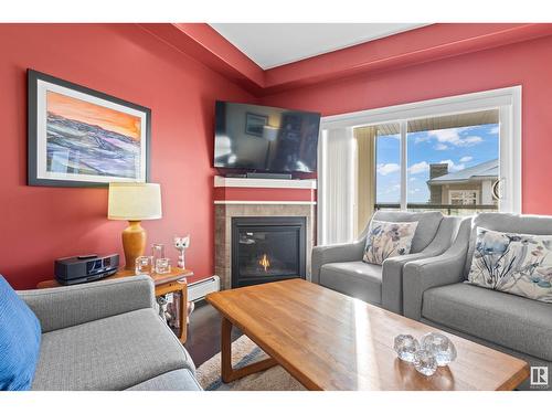 #467 11517 Ellerslie Rd Sw, Edmonton, AB - Indoor Photo Showing Living Room With Fireplace