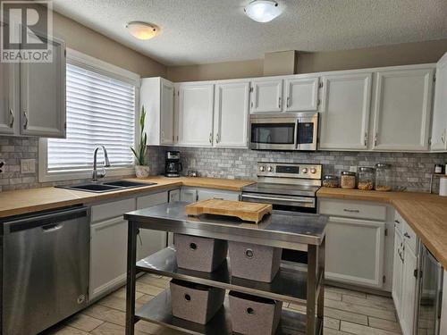 131 Wolverine Drive, Fort Mcmurray, AB - Indoor Photo Showing Kitchen With Stainless Steel Kitchen With Double Sink