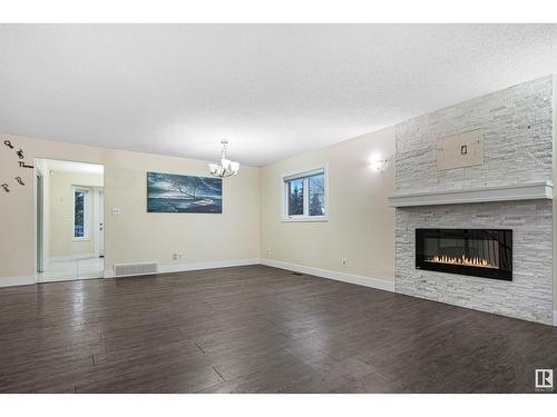 1207 54 St Nw, Edmonton, AB - Indoor Photo Showing Living Room With Fireplace