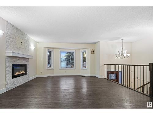 1207 54 St Nw, Edmonton, AB - Indoor Photo Showing Living Room With Fireplace