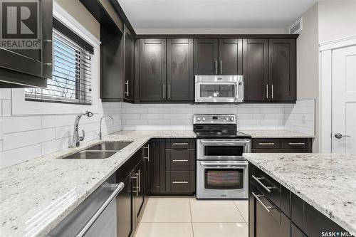 526 Baltzan Bay, Saskatoon, SK - Indoor Photo Showing Kitchen With Double Sink With Upgraded Kitchen