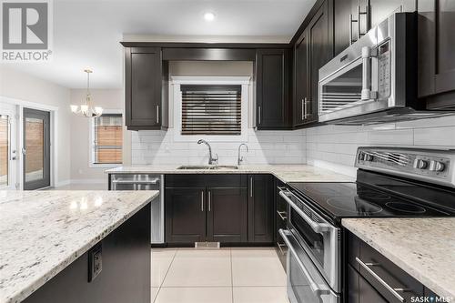 526 Baltzan Bay, Saskatoon, SK - Indoor Photo Showing Kitchen With Upgraded Kitchen