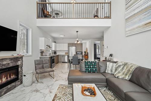 Salon - 220 Rue De L'Everest, La Conception, QC - Indoor Photo Showing Living Room With Fireplace