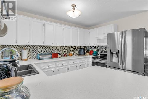 1502 12Th Avenue N, Regina, SK - Indoor Photo Showing Kitchen With Double Sink