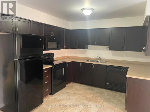 22 - 2551 Sixth Line E, Oakville (Uptown Core), ON - Indoor Photo Showing Kitchen With Double Sink