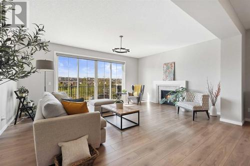 246 Sage Meadows Green Nw, Calgary, AB - Indoor Photo Showing Living Room With Fireplace