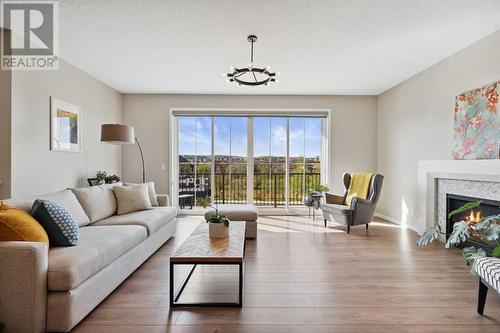 246 Sage Meadows Green Nw, Calgary, AB - Indoor Photo Showing Living Room With Fireplace