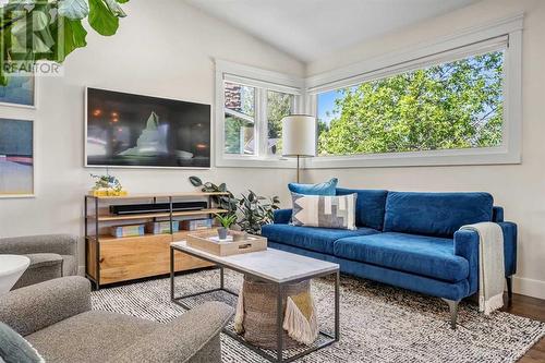 Loads of natural light floods this room - 432 Strathcona Mews Sw, Calgary, AB - Indoor Photo Showing Living Room