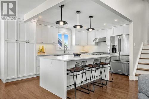 Custom kitchen & Island - 432 Strathcona Mews Sw, Calgary, AB - Indoor Photo Showing Kitchen With Upgraded Kitchen