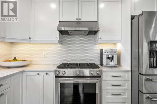 Timeless shaker cabinets - 432 Strathcona Mews Sw, Calgary, AB - Indoor Photo Showing Kitchen With Upgraded Kitchen