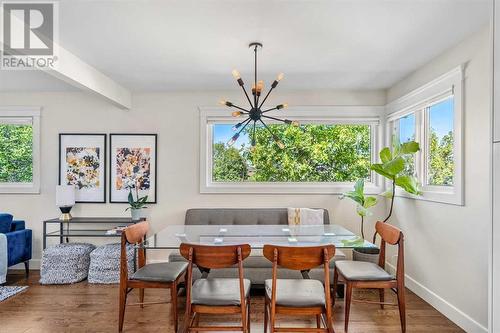 Large windows in formal dining area - 432 Strathcona Mews Sw, Calgary, AB - Indoor Photo Showing Dining Room