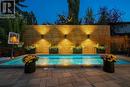 Privacy screen with lighting - 432 Strathcona Mews Sw, Calgary, AB  - Outdoor With In Ground Pool 