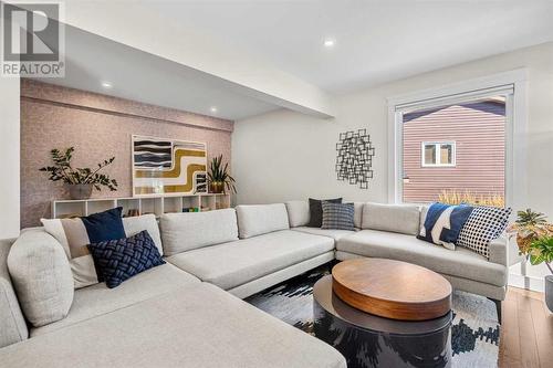 Loads of room to host a movie night - 432 Strathcona Mews Sw, Calgary, AB - Indoor Photo Showing Living Room