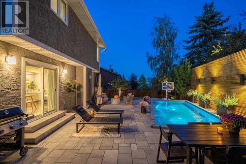 Perfect for family time! - 432 Strathcona Mews Sw, Calgary, AB - Outdoor With In Ground Pool With Deck Patio Veranda