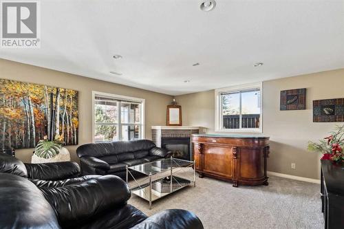 69 Evansbrooke Park Nw, Calgary, AB - Indoor Photo Showing Living Room With Fireplace