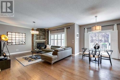 51 Evergreen Manor Sw, Calgary, AB - Indoor Photo Showing Living Room With Fireplace