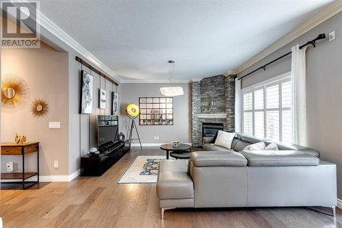 51 Evergreen Manor Sw, Calgary, AB - Indoor Photo Showing Living Room With Fireplace