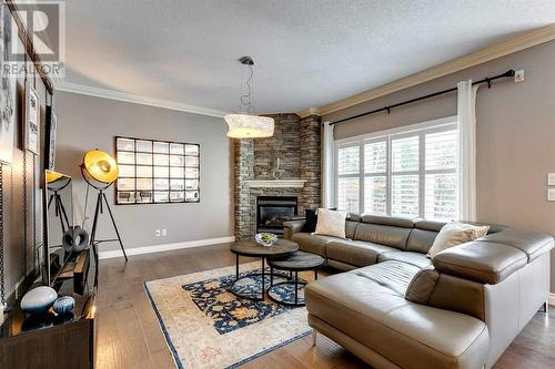 51 Evergreen Manor Sw, Calgary, AB - Indoor Photo Showing Living Room With Fireplace