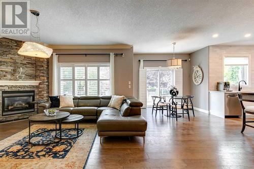 51 Evergreen Manor Sw, Calgary, AB - Indoor Photo Showing Living Room With Fireplace