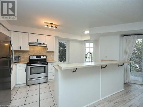 2301 Parkhaven Boulevard Unit# 204, Oakville, ON - Indoor Photo Showing Kitchen With Stainless Steel Kitchen