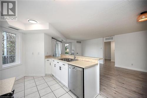 2301 Parkhaven Boulevard Unit# 204, Oakville, ON - Indoor Photo Showing Kitchen With Double Sink