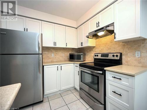 2301 Parkhaven Boulevard Unit# 204, Oakville, ON - Indoor Photo Showing Kitchen With Stainless Steel Kitchen