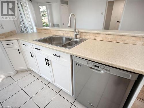 2301 Parkhaven Boulevard Unit# 204, Oakville, ON - Indoor Photo Showing Kitchen With Double Sink