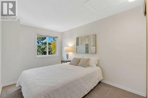 Secondary Bedroom - 153 Woodglen Grove Sw, Calgary, AB - Indoor Photo Showing Bedroom