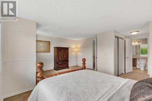 Primary Suite has plenty of space for a reading nook - 153 Woodglen Grove Sw, Calgary, AB - Indoor Photo Showing Bedroom