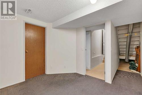 Flex Space in Basement - 153 Woodglen Grove Sw, Calgary, AB - Indoor Photo Showing Other Room