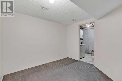 Flex Space in Basement - 153 Woodglen Grove Sw, Calgary, AB - Indoor Photo Showing Other Room