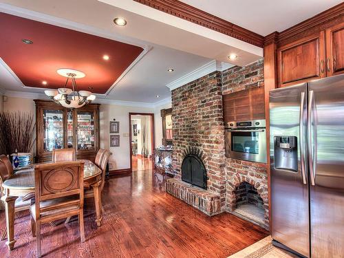 Dining room - 1105 Rue Marois, Laval (Sainte-Dorothée), QC - Indoor With Fireplace