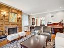 Salle familiale - 7 Rue Granville, Hampstead, QC  - Indoor Photo Showing Living Room With Fireplace 