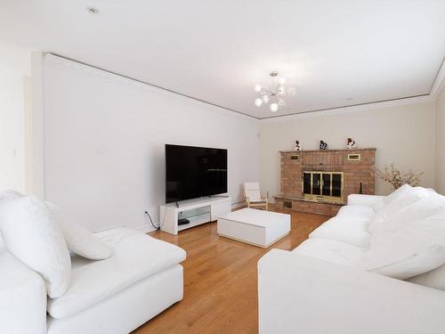 Salle familiale - 188 Rue Sidney-Cunningham, Beaconsfield, QC - Indoor Photo Showing Living Room With Fireplace