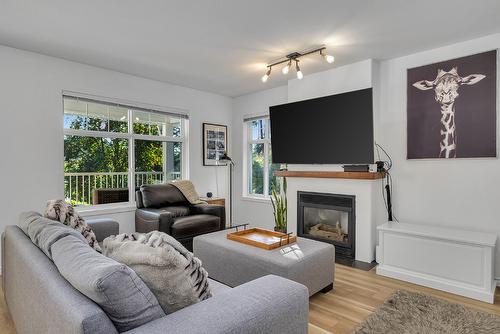 112-3825 Glen Canyon Drive, West Kelowna, BC - Indoor Photo Showing Living Room With Fireplace