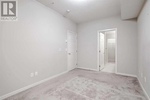 135, 20 Seton Park Se, Calgary, AB - Indoor Photo Showing Other Room