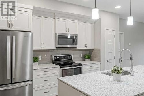 135, 20 Seton Park Se, Calgary, AB - Indoor Photo Showing Kitchen With Upgraded Kitchen