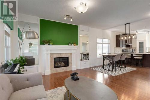 35 Nolanfield Heights Nw, Calgary, AB - Indoor Photo Showing Living Room With Fireplace