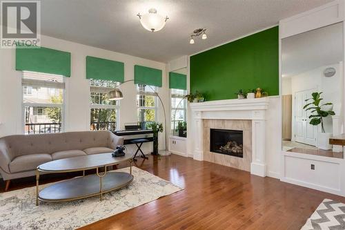 35 Nolanfield Heights Nw, Calgary, AB - Indoor Photo Showing Living Room With Fireplace