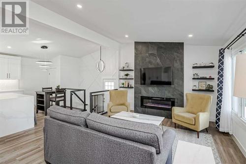 1315 105 Avenue Sw, Calgary, AB - Indoor Photo Showing Living Room With Fireplace