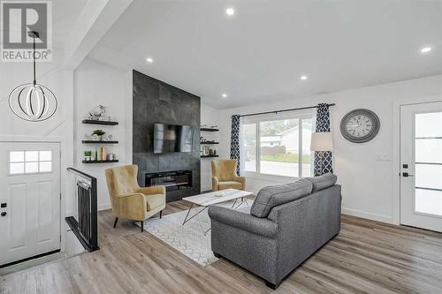 1315 105 Avenue Sw, Calgary, AB - Indoor Photo Showing Living Room With Fireplace