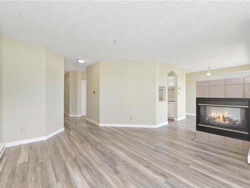 401-935 Johnson St, Victoria, BC - Indoor Photo Showing Living Room With Fireplace