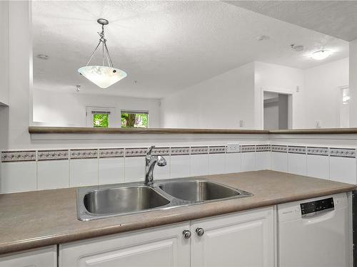 103-380 Waterfront Cres, Victoria, BC - Indoor Photo Showing Kitchen With Double Sink