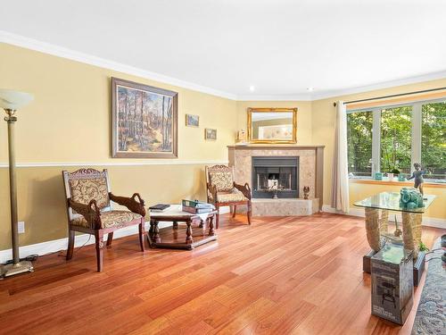 Salle familiale - 5612 Rue Shumack, Montréal (Pierrefonds-Roxboro), QC - Indoor Photo Showing Living Room With Fireplace