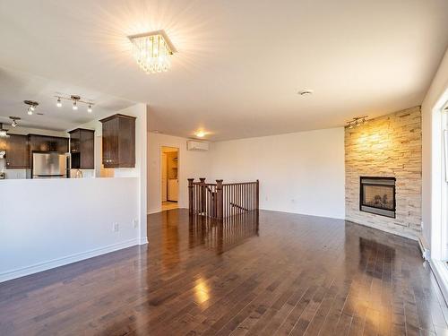 Living room - 4-4655 Ch. Des Prairies, Brossard, QC - Indoor With Fireplace